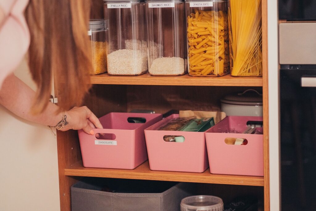 Neatly organised drawer with items sorted into labelled compartments